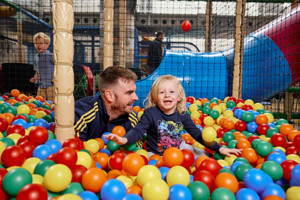 Fmily On A Playground Rubber Balls