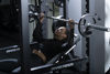 Woman Lifting Bench And Power Rack