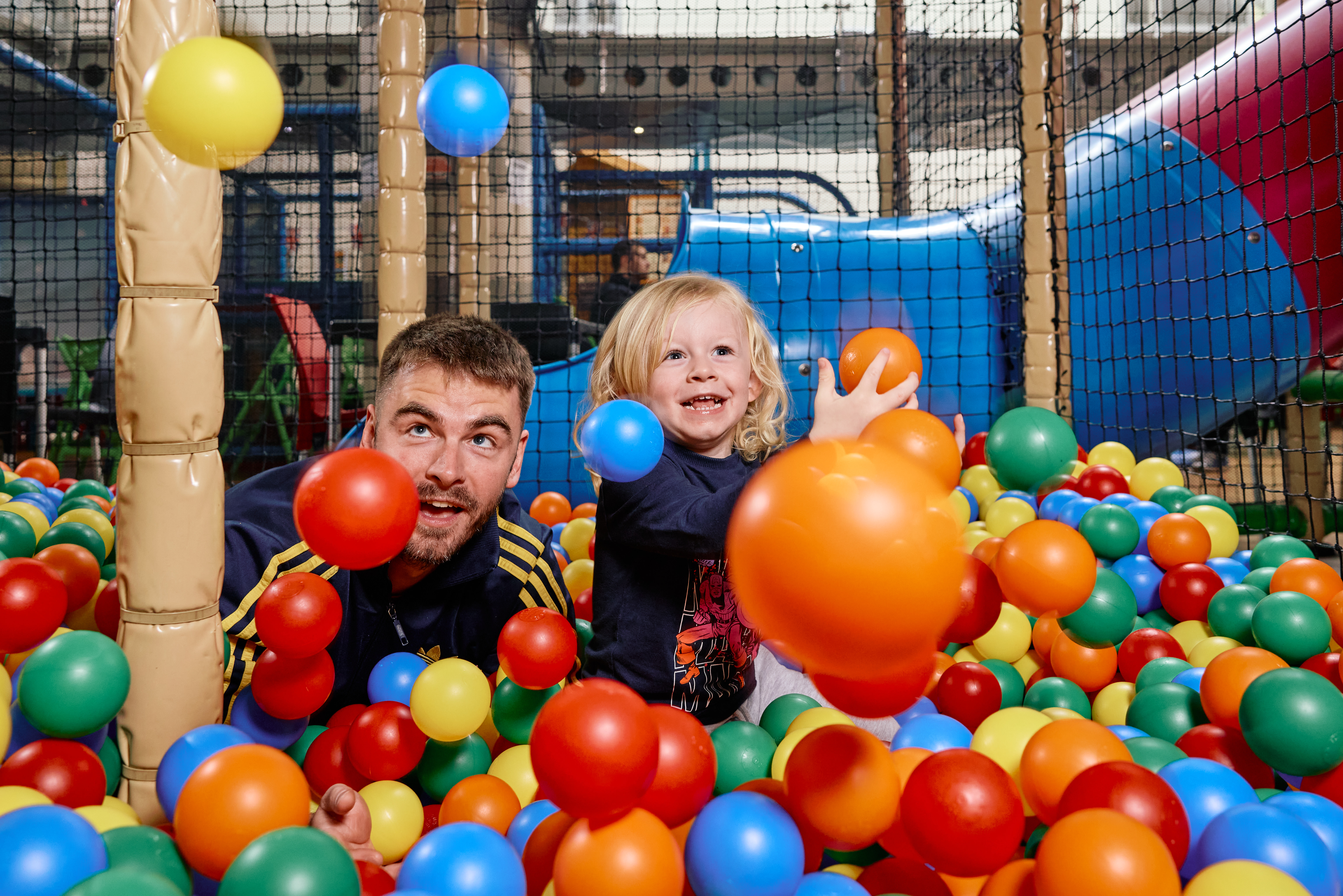 Family On A Playground Rubber Balls 2
