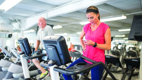 Female exercises on treadmill