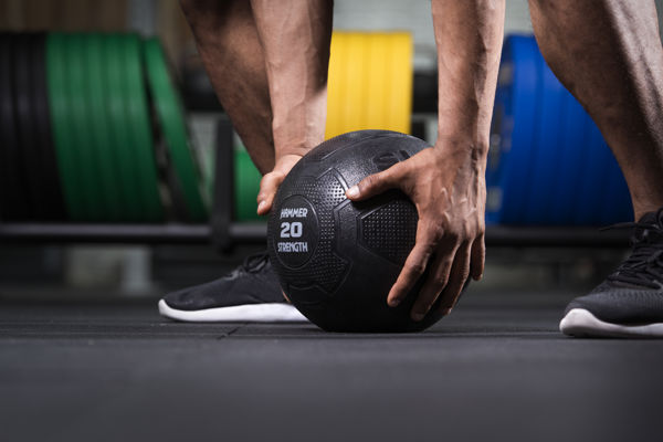 Exerciser pickingup slamball detail