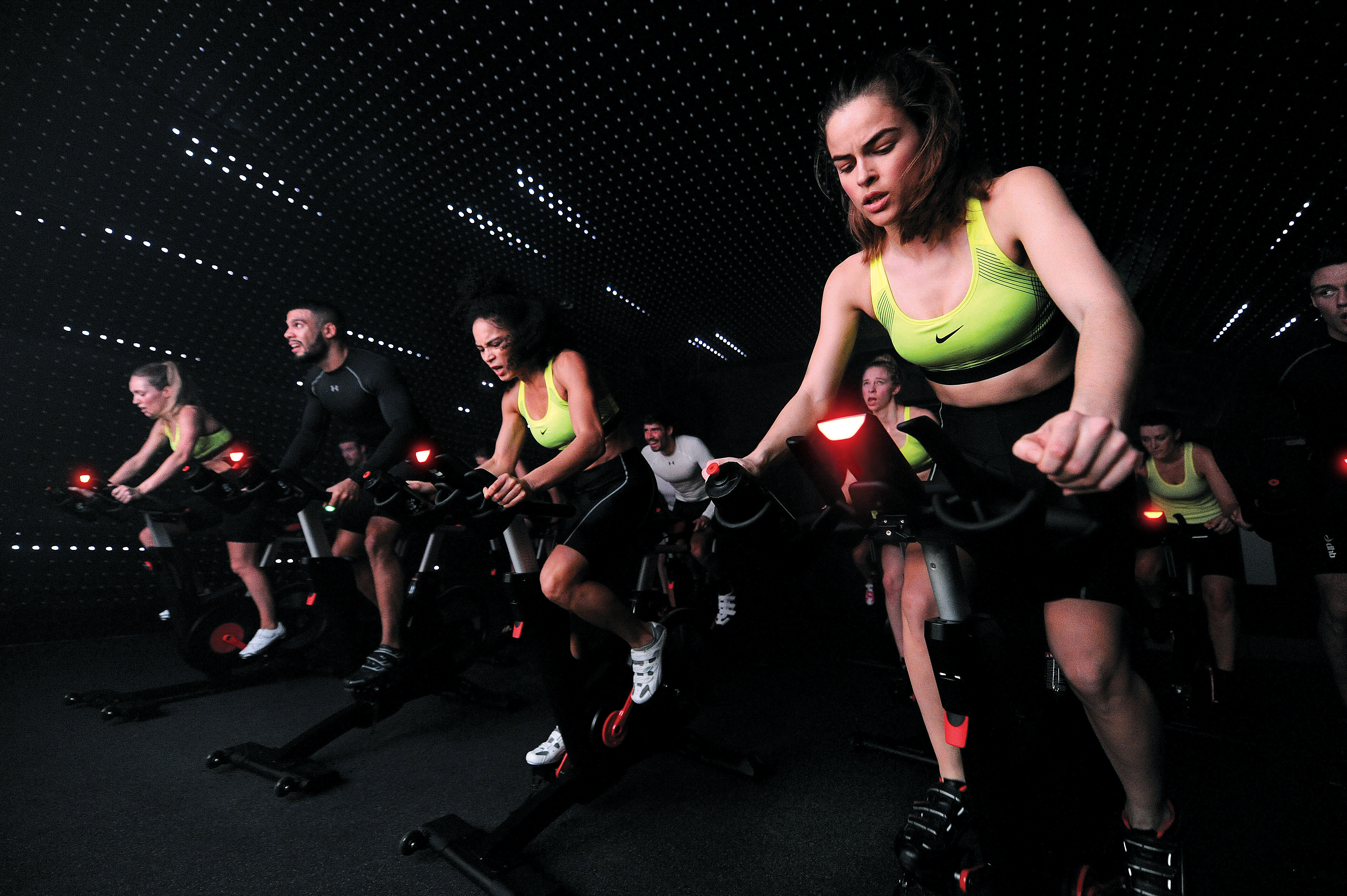 People on exercise bikes